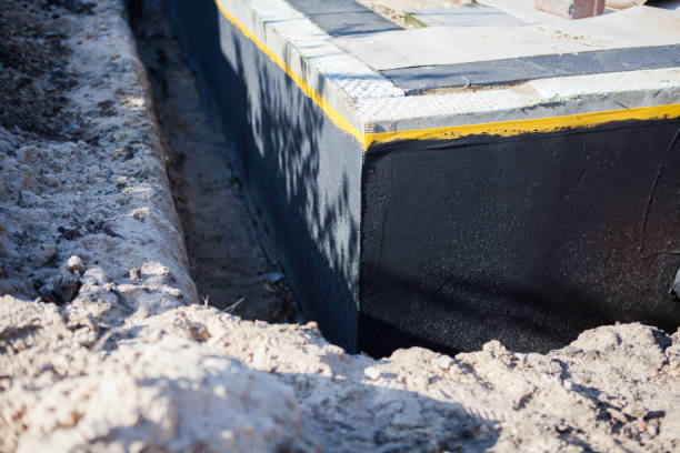 Professional Basement Waterproofing technician working in Tiffin, OH